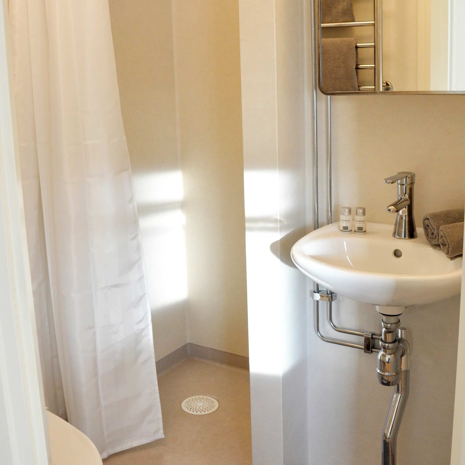 Bathroom in red cottage by sea