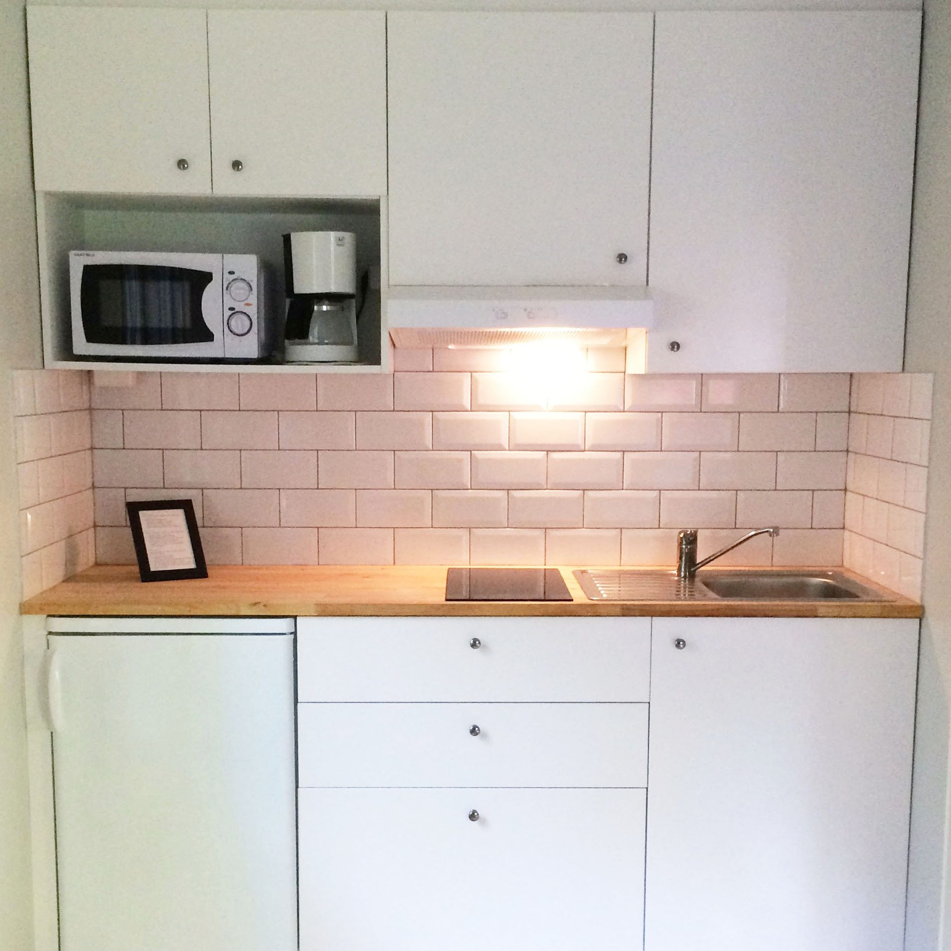 Kitchen in red cottage by the sea